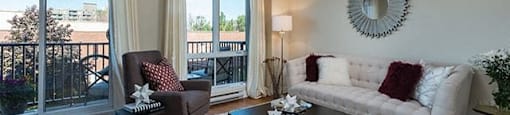 Excelsior Apartments living room with large windows in Montreal, QC