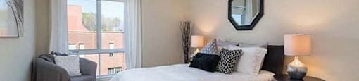 Excelsior Apartments master bedroom with hardwood flooring in Montreal, QC