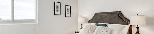 Victoria Place bedroom with white walls and hard surface flooring in Saskatoon, SK