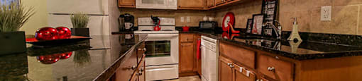 Garden Court in Windsor, ON kitchen with fridge, stove and dishwasher
