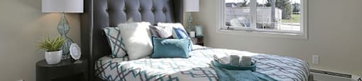 Airdrie Place in Airdrie, AB Contemporary style bedroom with large window