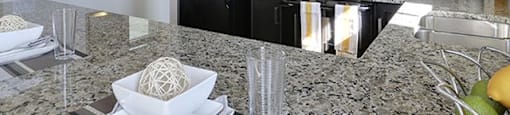 Airdrie Place in Airdrie, AB Contemporary style kitchen lit by natural light