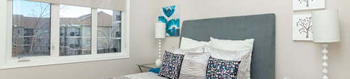 Beacon Heights in Calgary, AB brightly lit bedroom with large window