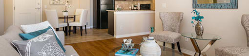 Beacon Heights in Calgary, AB living room opens to dining room and kitchen
