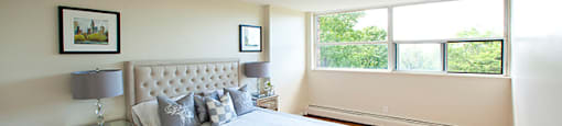 Brookbanks Apartments large, contemporary bedroom with lots of natural light in Toronto, ON