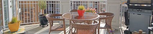 The Conservatory spacious balcony with room for table and chairs and BBQ in Kelowna, BC