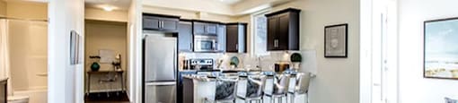 Giroux Estates in St. Albert, AB kitchen with breakfast bar granite counter tops