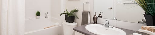 Summerhill Village apartments bathroom featuring tub shower in Nanaimo, BC