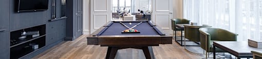 The Taunton Apartments billiards room featuring flat screen TV and pool table in Oakville, ON