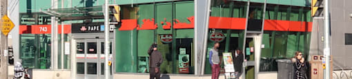 A building with a red logo on the front.