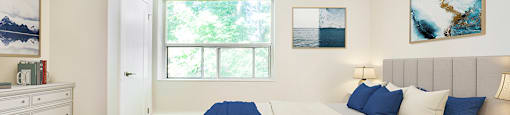 Park Towers Apartments image of bedroom looking towards window of a renovated 1 bedroom at 55 Carfrae in London, ON