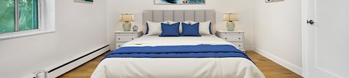 Park Towers Apartments image of bedroom, with window on left side of a renovated 1 bedroom at 55 Carfrae in London, ON