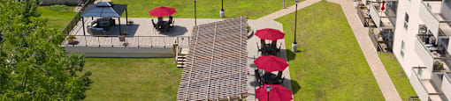 Outdoor patio with seating and gazebos at Prince Court and Princess Manor in Welland, ON