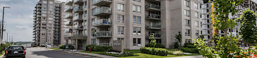 Building 3400 where the rental office is located at Axial Towers in Laval