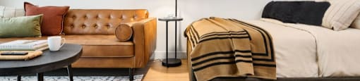 The Duke Vancouver BC Studio suite with room for a double bed, couch, coffee table and small dining table.