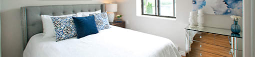 Elegant bedroom with hard surface flooring in Whitby, ON