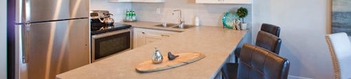 Regency Towers modern kitchen with stainless steel appliances in St. Catherines, ON