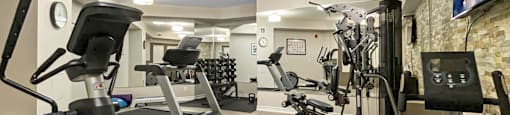 a gym with various exercise equipment and a tv at Rittenhouse Apartments in Kitchener Ontario