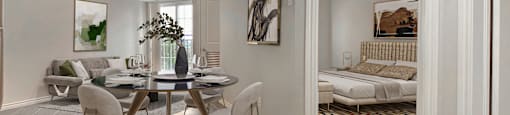 a dining room with a table and chairs at Rittenhouse Apartments in Kitchener Ontario