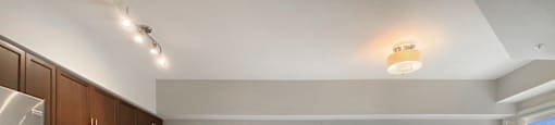 a kitchen and living room with a dining room table and chairs at Rittenhouse Apartments in Kitchener Ontario