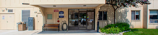 Main building entrance as seen from parking lot at Riverbend Tower Apartments in Chatham, ON
