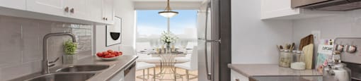 Kitchen with premium cabinetry and stainless steel appliances at Riverbend Tower Apartments in Chatham, ON