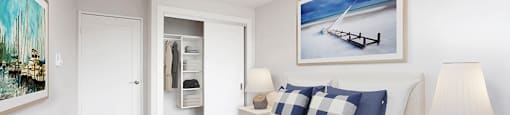 Primary bedroom, looking towards closet with built in storage, at Riverbend Tower Apartments in Chatman, OM