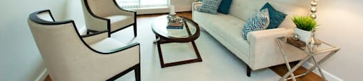 Lord Simcoe Apartments bright, spacious living room with access to balcony in