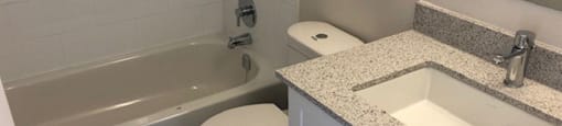 San Remo/Monaco in Toronto, ON bathroom with full sized bathtub, modern cabinetry and countertop