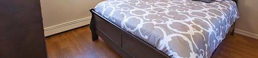 Shannon Towers in Collingwood, ON large bedroom with hard surface flooring