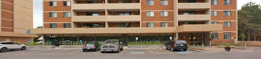 Silvercreek Towers in Georgetown, ON exterior of building and parking lot
