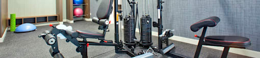 Springbank Apartments in London, ON gym with weight lifting machine