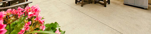 Springbank Apartments in London, ON outdoor patio with seating and BBQ