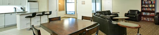 Springbank Apartments social room with dining table and full kitchen in London, ON