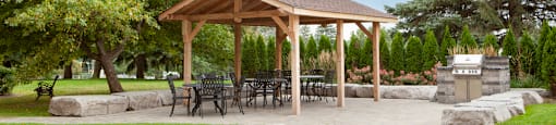 Sunnidale Place in Barrie, ON outdoor patio with gazebo with seating and BBQ area