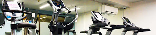 Fitness center with cardio machines at Surrey Village in Surrey, BC