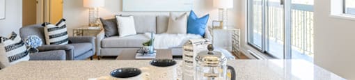 living room with a couch and a table at Surrey Village Apartments in Surrey BC