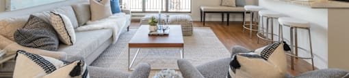 a living room with a couch and a table at Surrey Village in Surrey BC