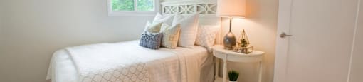Tamarack Woods Breezy bedroom with windows and light white covers in Barrie, ON