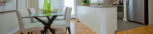 Tamarack Woods Open concept kitchen and dining room with view of the outdoor patio in Barrie, ON