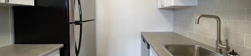 Kitchen at Tarawood Place in Peterborough, featuring white designer cabinetry and stainless steel appliances