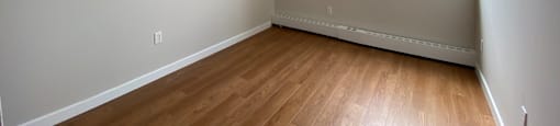 Second bedroom in a two bedroom apartment looking towards sliding glass window at Tarawood Place in Peterborough, ON