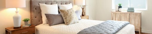 Testa Heights Apartments in Uxbridge, ON Second Bedroom featuring double-size bed and side tables