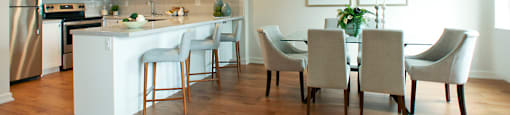 Testa Heights Apartments in Uxbridge, ON Dining Room with view into kitchen featuring breakfast bar with extra seating