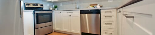 Testa Heights Apartments in Uxbridge, ON Kitchen featuring stainless steel fridge, stove, over-the-range microwave and dishwasher included