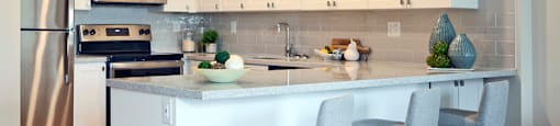 Testa Heights Apartments in Uxbridge, ON Kitchen featuring breakfast bar with extra seating