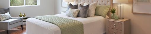 Testa Heights Apartments in Uxbridge, ON Master Bedroom featuring hard surface flooring, ceiling light and window with roller blinds included