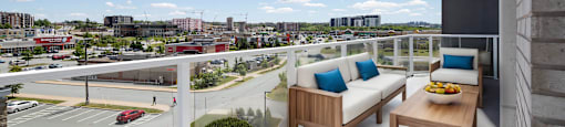 a balcony with two couches and a table