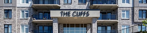 an apartment building with the cliffs sign on the front of it