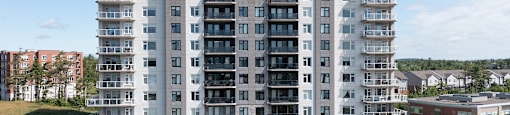 an aerial view of an apartment building on a sunny day